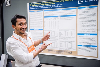 male student presenting his poster at the ACSM Annual Meeting