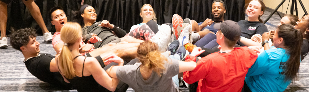 group of people doing core exercises in a circle